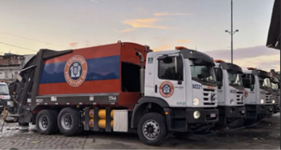 Row of parked garbage trucks